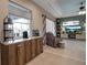 Open concept kitchen and Gathering room with built-in coffee bar at 9203 Winter Harbour Way, Bradenton, FL 34212