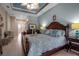 Spacious main bedroom with king-size bed and access to private bathroom at 9203 Winter Harbour Way, Bradenton, FL 34212