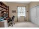 Home office with built-in shelving and a desk at 9203 Winter Harbour Way, Bradenton, FL 34212