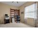 Home office with built-in shelving and a desk at 9203 Winter Harbour Way, Bradenton, FL 34212