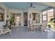 Covered patio with table and chairs, adjacent to pool at 9203 Winter Harbour Way, Bradenton, FL 34212