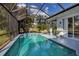 Inviting screened pool with spa and lush landscaping at 9203 Winter Harbour Way, Bradenton, FL 34212