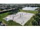 Well-maintained sand volleyball court with nets and surrounding landscaping at 9203 Winter Harbour Way, Bradenton, FL 34212
