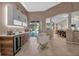 Modern wet bar with wine cooler, cabinetry, and pool view at 9203 Winter Harbour Way, Bradenton, FL 34212