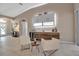 Modern wet bar with wine cooler, cabinetry, and seating area at 9203 Winter Harbour Way, Bradenton, FL 34212