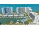 Aerial view of waterfront condo building with marina and pool at 988 Blvd Of The Arts # 311, Sarasota, FL 34236