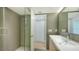 Clean bathroom with a walk-in shower and vanity at 988 Blvd Of The Arts # 311, Sarasota, FL 34236
