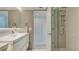 Clean bathroom with walk-in shower and modern vanity at 988 Blvd Of The Arts # 311, Sarasota, FL 34236