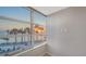 Bedroom with large windows and water views at 988 Blvd Of The Arts # 311, Sarasota, FL 34236