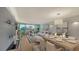 Elegant dining area with hardwood floors and water views at 988 Blvd Of The Arts # 311, Sarasota, FL 34236