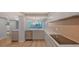 Modern kitchen with quartz countertops and stainless steel appliances at 988 Blvd Of The Arts # 311, Sarasota, FL 34236