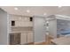 Modern kitchen with white cabinets and wine cooler at 988 Blvd Of The Arts # 311, Sarasota, FL 34236