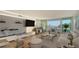Living room with hardwood floors and water views at 988 Blvd Of The Arts # 311, Sarasota, FL 34236