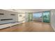 Living room with hardwood floors and balcony access at 988 Blvd Of The Arts # 311, Sarasota, FL 34236