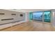 Living room with hardwood floors and water views at 988 Blvd Of The Arts # 311, Sarasota, FL 34236