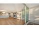 Light-filled living area with hardwood floors and balcony access at 988 Blvd Of The Arts # 311, Sarasota, FL 34236