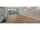 Bright living room with hardwood floors and water views at 988 Blvd Of The Arts # 311, Sarasota, FL 34236