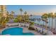 Resort-style pool with bayfront views and lush landscaping at 988 Blvd Of The Arts # 311, Sarasota, FL 34236
