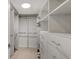 Spacious walk-in closet with ample shelving and hanging space at 988 Blvd Of The Arts # 311, Sarasota, FL 34236