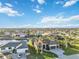 Overhead aerial view of neighborhood featuring houses on a canal and beautiful Florida foliage at 1111 Socorro Dr, Punta Gorda, FL 33950