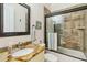 Well-appointed bathroom with granite vanity and shower at 1111 Socorro Dr, Punta Gorda, FL 33950