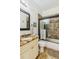 Clean bathroom with granite vanity and a tub shower combo at 1111 Socorro Dr, Punta Gorda, FL 33950