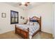 Bright bedroom with wood bed frame and window seat at 1111 Socorro Dr, Punta Gorda, FL 33950