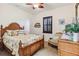 Guest bedroom with wood bed frame and sitting area at 1111 Socorro Dr, Punta Gorda, FL 33950