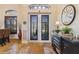 Elegant entryway with double doors and a large clock at 1111 Socorro Dr, Punta Gorda, FL 33950