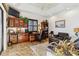 Home office with built-in cabinetry and comfortable seating area at 1111 Socorro Dr, Punta Gorda, FL 33950