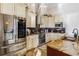 Kitchen features granite countertops, stainless steel appliances, and custom cabinetry at 1111 Socorro Dr, Punta Gorda, FL 33950