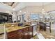 Island kitchen with granite counters, stainless steel appliances, and breakfast bar at 1111 Socorro Dr, Punta Gorda, FL 33950