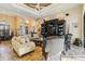Comfortable living room with ample seating and built in shelving at 1111 Socorro Dr, Punta Gorda, FL 33950