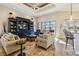 Bright living room with plenty of seating and a large TV at 1111 Socorro Dr, Punta Gorda, FL 33950