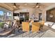 Outdoor patio area perfect for entertaining with dining table, ceiling fans, and TV at 1111 Socorro Dr, Punta Gorda, FL 33950