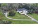 Aerial view of house, detached garage, and expansive lawn at 15125 Waterline Rd, Bradenton, FL 34212