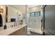 Clean bathroom with subway tile shower, hexagon floor, and floating vanity at 15125 Waterline Rd, Bradenton, FL 34212