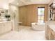 Luxurious bathroom with soaking tub, walk-in shower, and double vanity at 15125 Waterline Rd, Bradenton, FL 34212