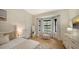 Bright bedroom with bay window, light wood floors, and calming decor at 15125 Waterline Rd, Bradenton, FL 34212