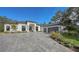 Modern home with a gray paver driveway and attached garage at 15125 Waterline Rd, Bradenton, FL 34212
