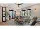 Gathering room with sectional sofa, and access to outdoor patio at 15125 Waterline Rd, Bradenton, FL 34212