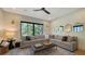 Bright Gathering room with sectional sofa and multiple windows at 15125 Waterline Rd, Bradenton, FL 34212