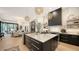 Modern kitchen with large island, marble countertops, and high end appliances at 15125 Waterline Rd, Bradenton, FL 34212