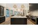 Open concept kitchen with a large island and marble countertops at 15125 Waterline Rd, Bradenton, FL 34212