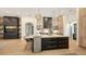 Large kitchen island with marble top and stylish cabinetry at 15125 Waterline Rd, Bradenton, FL 34212