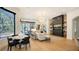 Bright living room with breakfast nook, built-in shelving, and hardwood floors at 15125 Waterline Rd, Bradenton, FL 34212