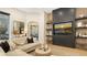Cozy living room with sectional sofa, fireplace, and built-in shelving at 15125 Waterline Rd, Bradenton, FL 34212