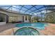 Relaxing pool and spa area with covered lanai and outdoor views at 15125 Waterline Rd, Bradenton, FL 34212