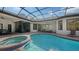 Resort-style pool and spa with covered lanai at 15125 Waterline Rd, Bradenton, FL 34212