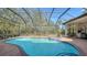 Screened pool and spa with spacious patio and lush landscaping at 15125 Waterline Rd, Bradenton, FL 34212